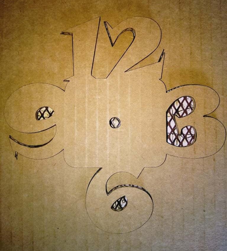 imagem do arquivo vetor para download Relógio de Parede de Papelão
